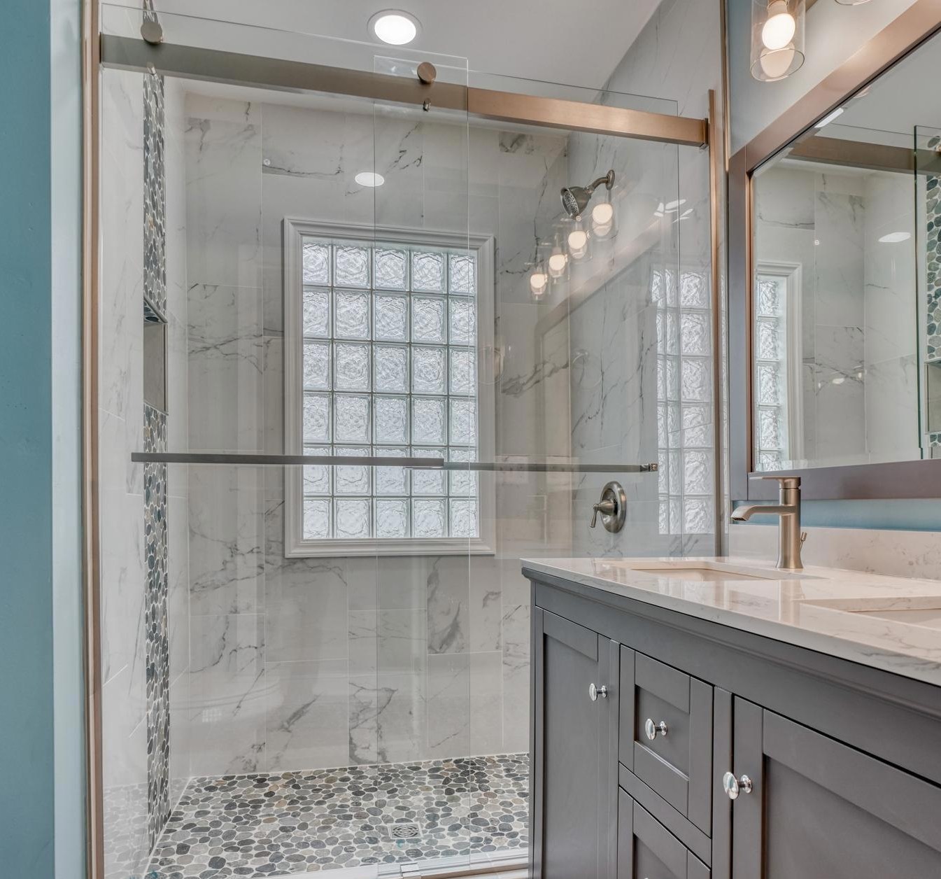 Renovated bathroom with glass shower and modern fixtures